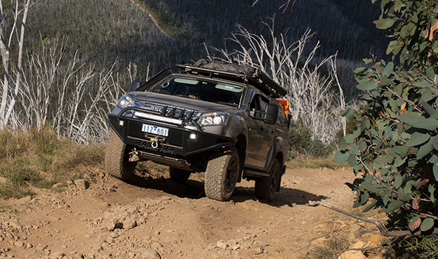 Isuzu D-MAX ascends cliff-side dirt track