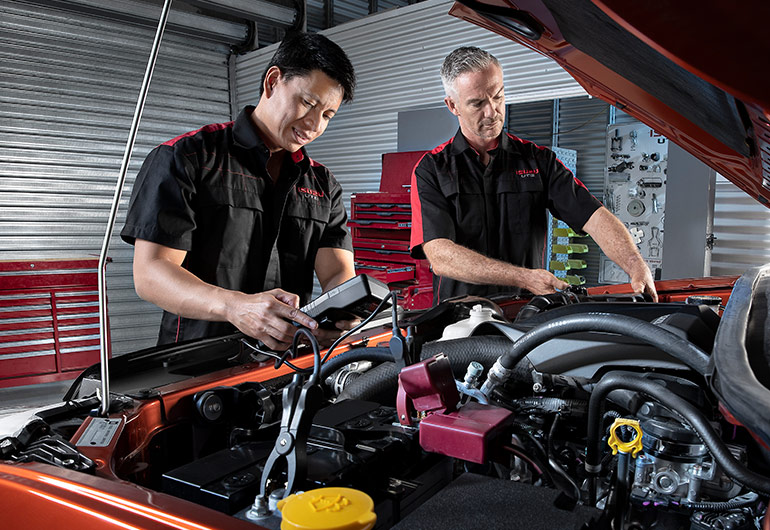 Two Isuzu Ute Service Plus technicians