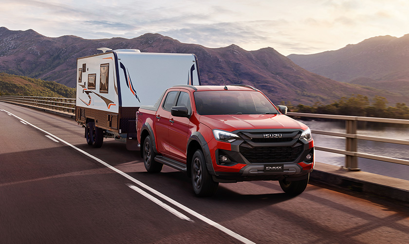 Isuzu D-MAX X-TERRAIN towing a caravan on a touring adventure