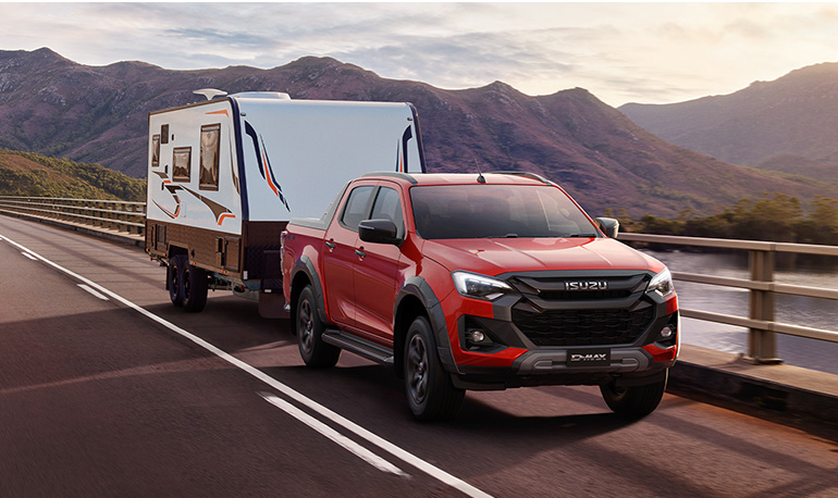 Isuzu D-MAX X-TERRAIN towing a caravan on a touring adventure